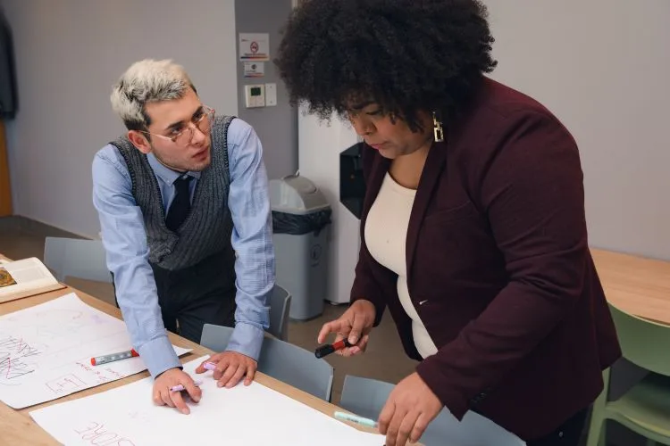 AIQA Training and Teaching person helping women